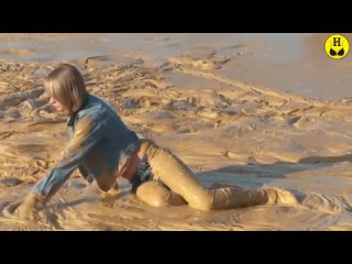 brunette getting muddy in tight jeans